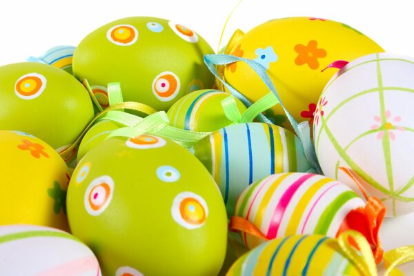 Multicolored painted Easter eggs on a white background