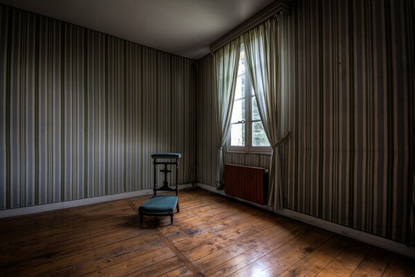 A chair with a window in the room