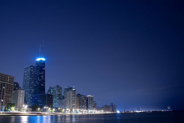 Evening lights of the city embankment