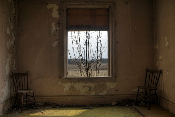 Window, chairs in an old room