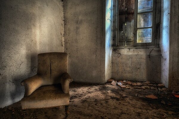 A chair in a gloomy old room