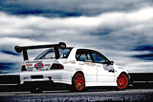 Tuned Mitsubishi Lancer against the sky