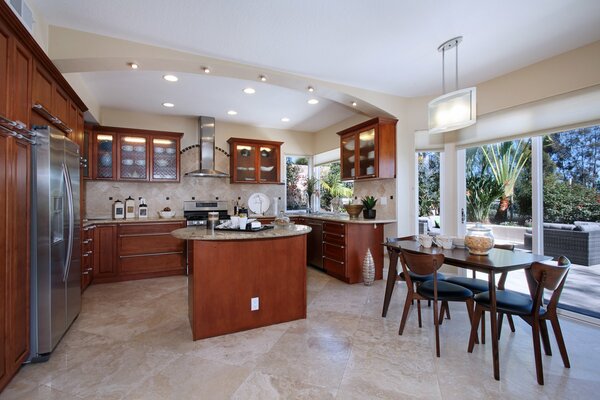 Kitchen interior in classic brown style with panoramic window