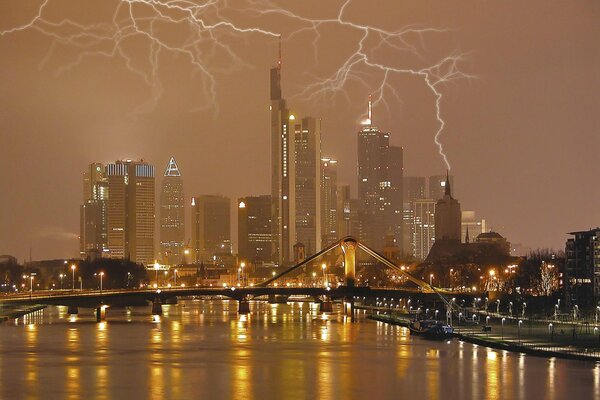 Big lightning spreads over the evening city