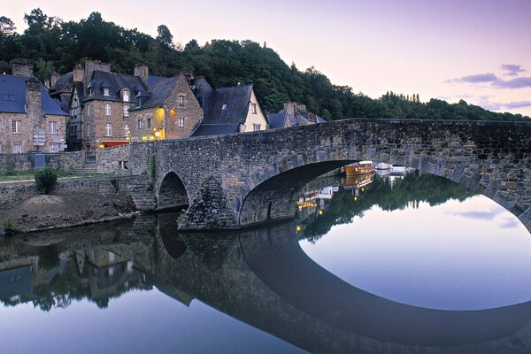 A bridge over a river in a French village