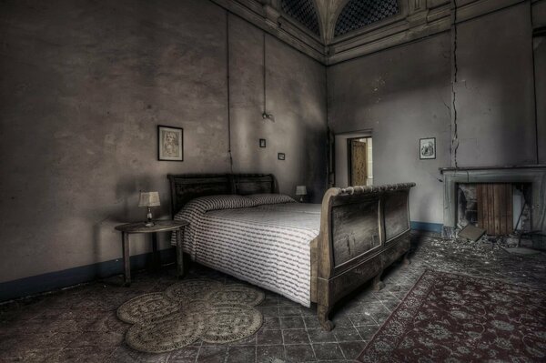 A bed in a gloomy room in brown tones