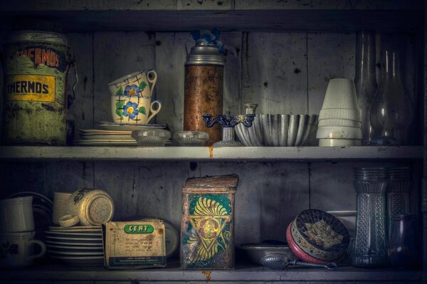 Old dishes in a wooden cabinet