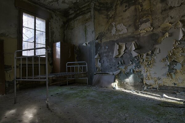 The interior of an old room with a bed