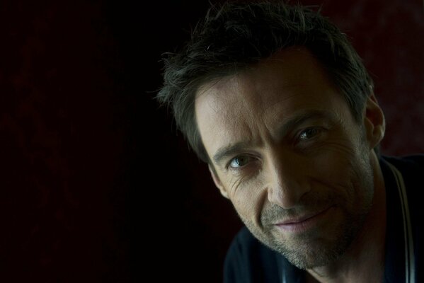 Famous actor Hugh Jackman on a dark background