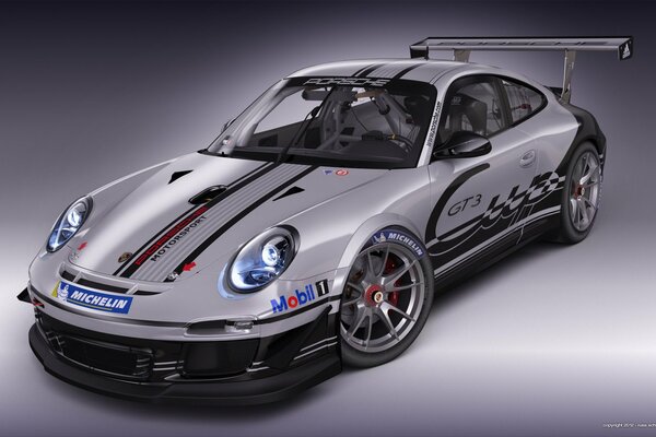 Grey sporty Porsche with spoiler