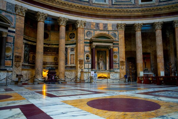 Marble hall with columns and a statue