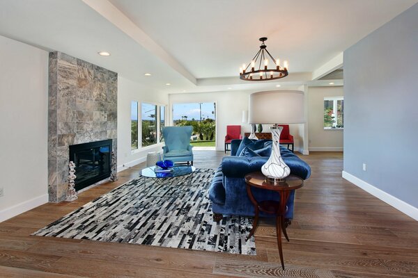 Stylish blue-style living room with fireplace