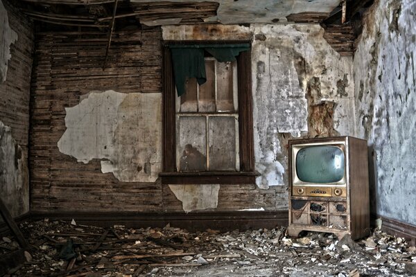 An old TV in a room without repair