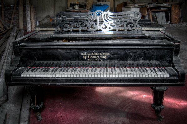 A dusty piano on a red floor