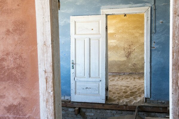 View from the room with the door open to the sand