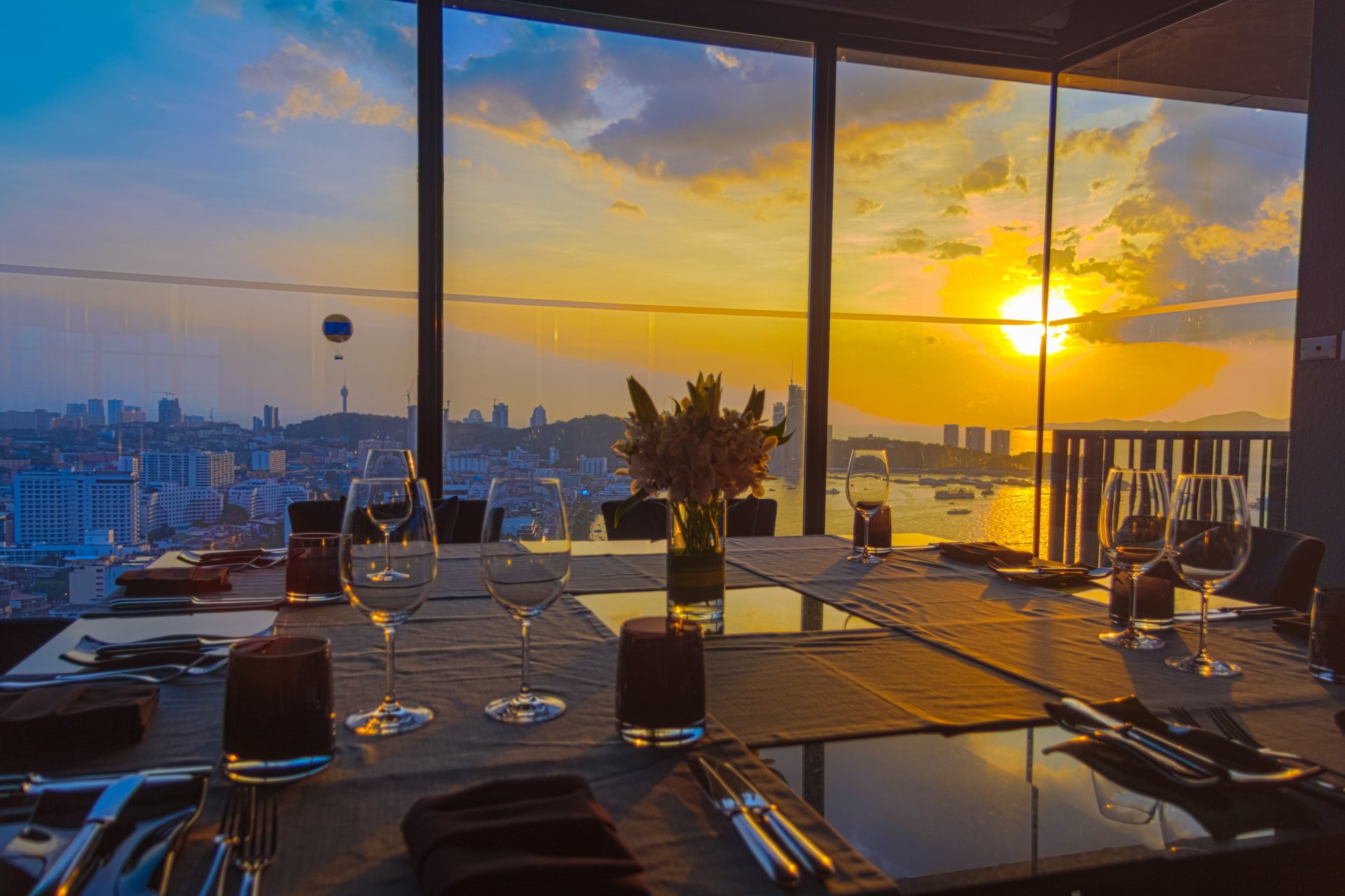 unset restaurant serving table town window night