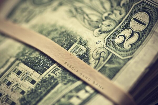 A stack of bandaged dollars. Macro