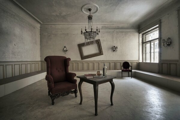 An old room. Curved picture frame. Large chandelier