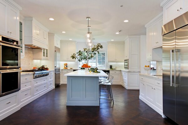 Large white kitchen with island