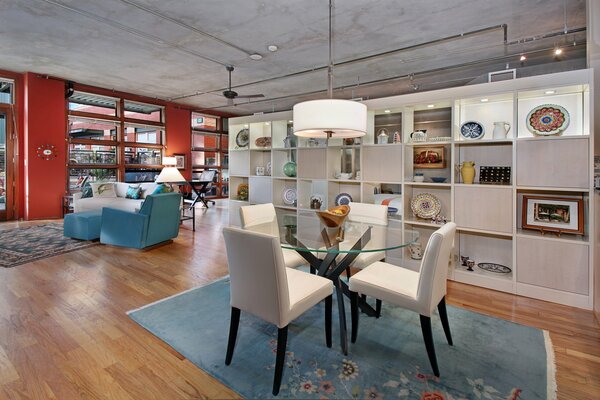 The interior of a large room with white and blue furniture