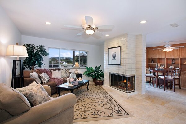 Cozy living room with fireplace in warm shades