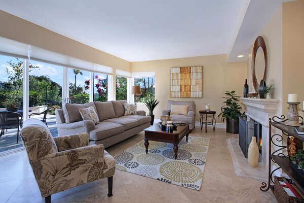 Cozy modern living room with beautiful furniture and panoramic windows