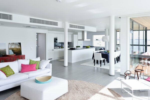 White living room with bright pillows