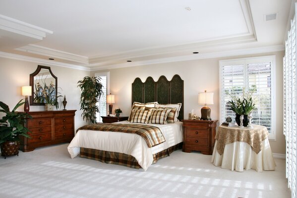 Mirror and bed in a spacious bedroom