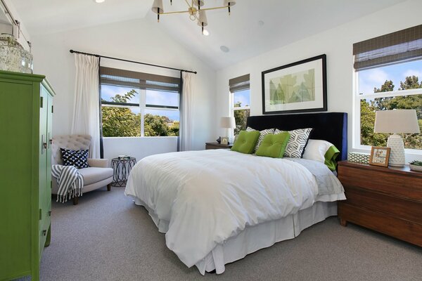 Bright bedroom with green accents