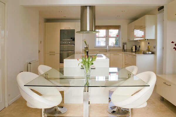 Bright spacious kitchen with flowers on the table