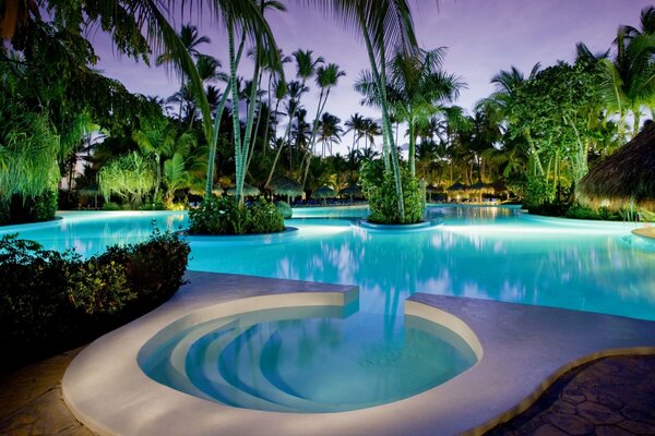 A beautiful swimming pool in a tropical hotel