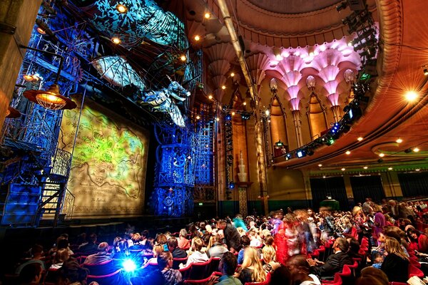 The audience is delighted with the lights in the theater hall