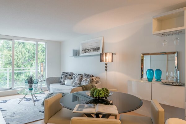 Interior of a room with a dining table and a sofa