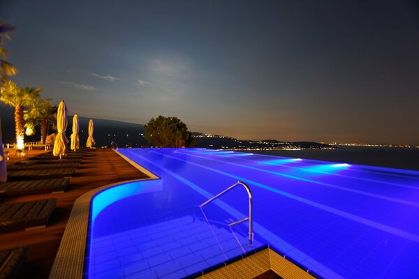 The pool is illuminated. Night landscape