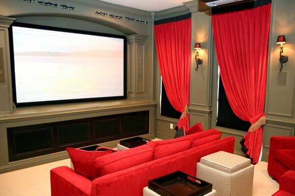 Private cinema with red sofas