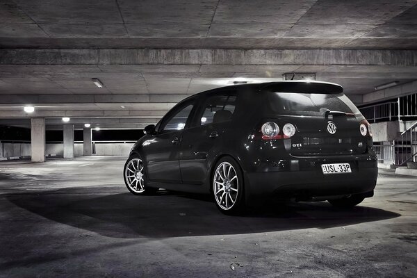 Wallpaper with a black car on the road