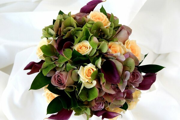 Wedding bouquet of yellow and purple roses