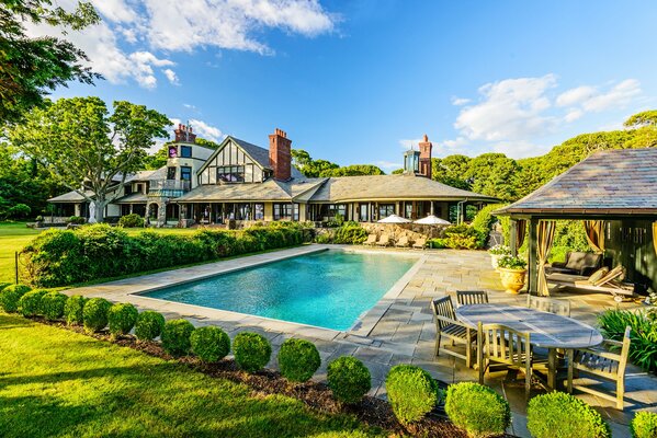 Blue pool at the house with sun beds