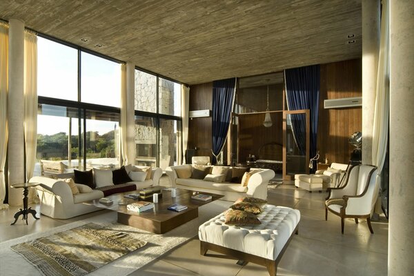 Beautiful interior of the house. The living room is equipped with chic Lere furniture with Lamas, sofa