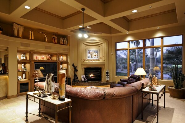 Living room with corner sofa by the fireplace