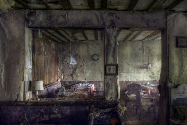 The interior of an old, abandoned dining room