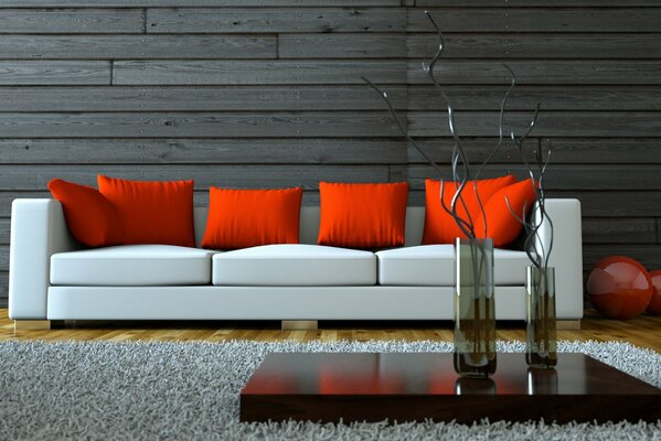 Stylish living room with a white sofa. red pillows and walls decorated with wood