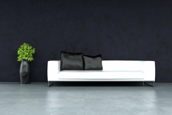 Stylish living room with a white sofa. black pillows and a floor vase