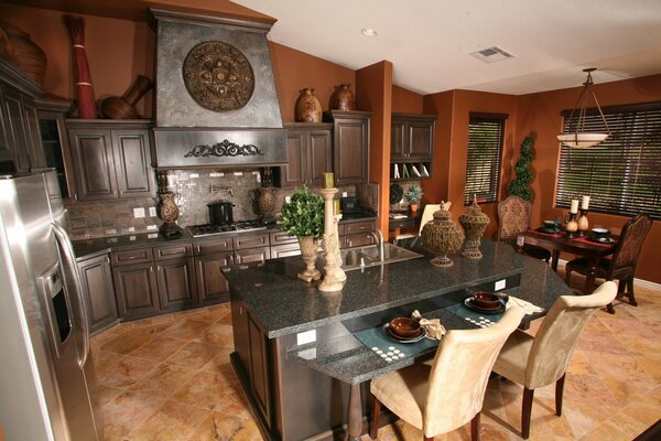 The kitchen in the villa is in brown tones