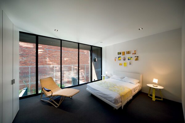 Cozy bedroom with an armchair and paintings