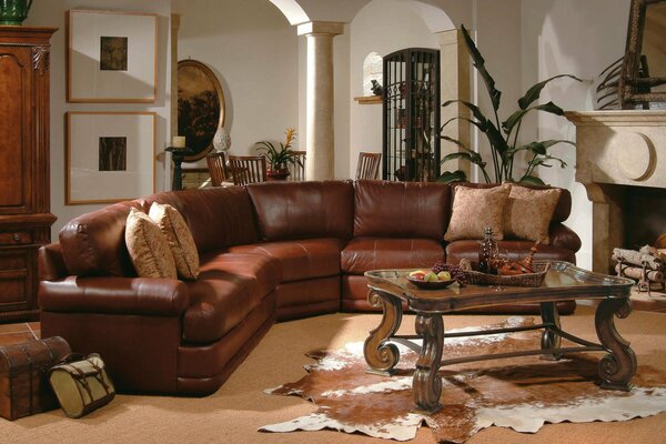 A room in warm colors with a leather sofa