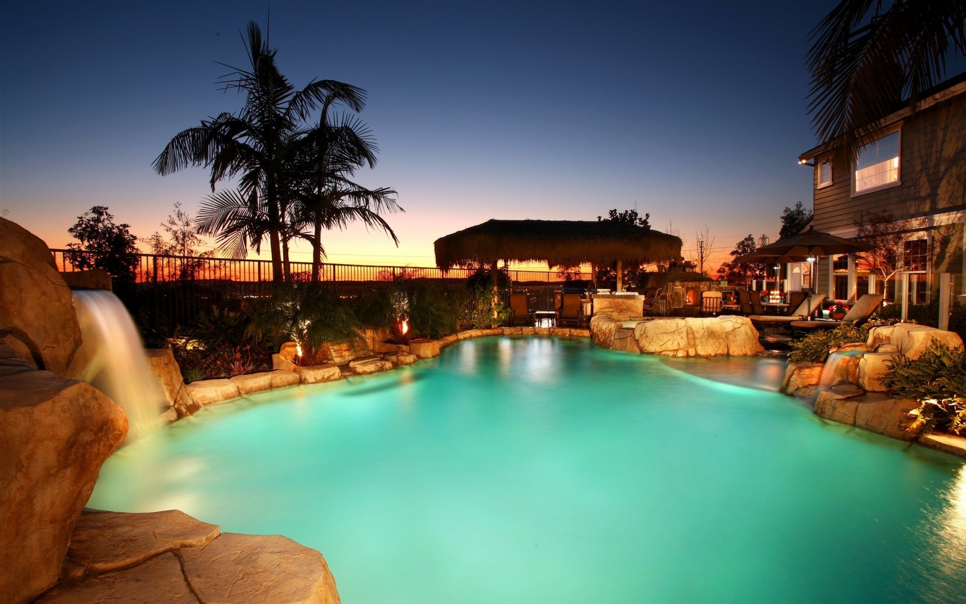 house pool waterfall stones whirlpool beds palm sunset