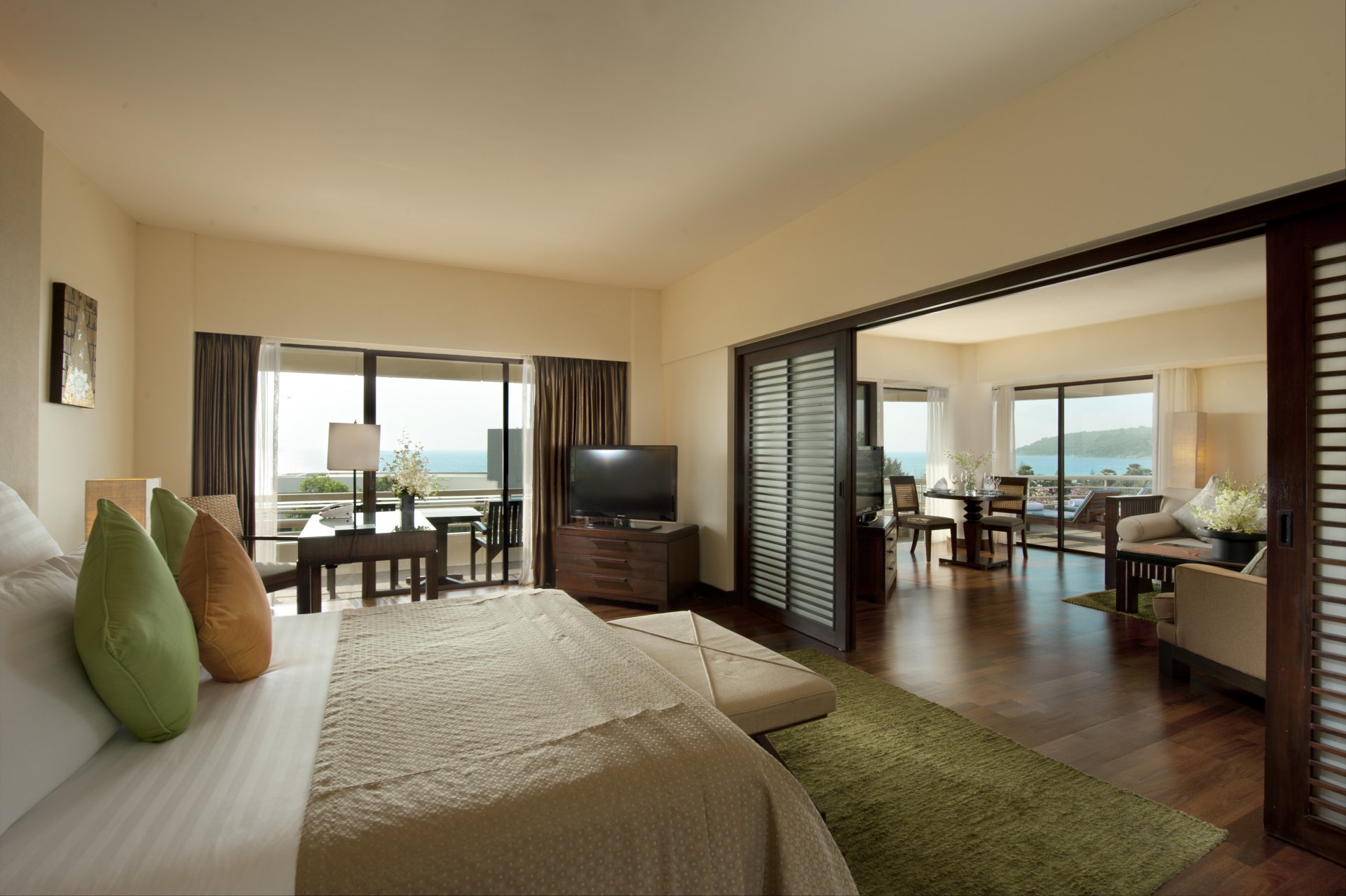 interior hotel hilton suite room hilton bedroom bed TV table armchair telephone room sofa table chairs balcony sun beds