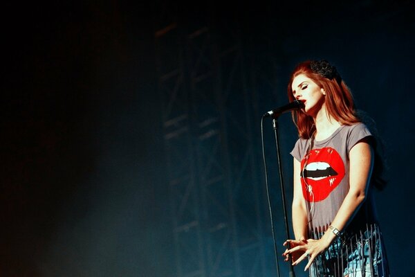 Beautiful singer at a concert with a microphone