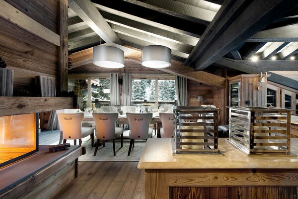 The chalet has a fireplace, a table with chairs